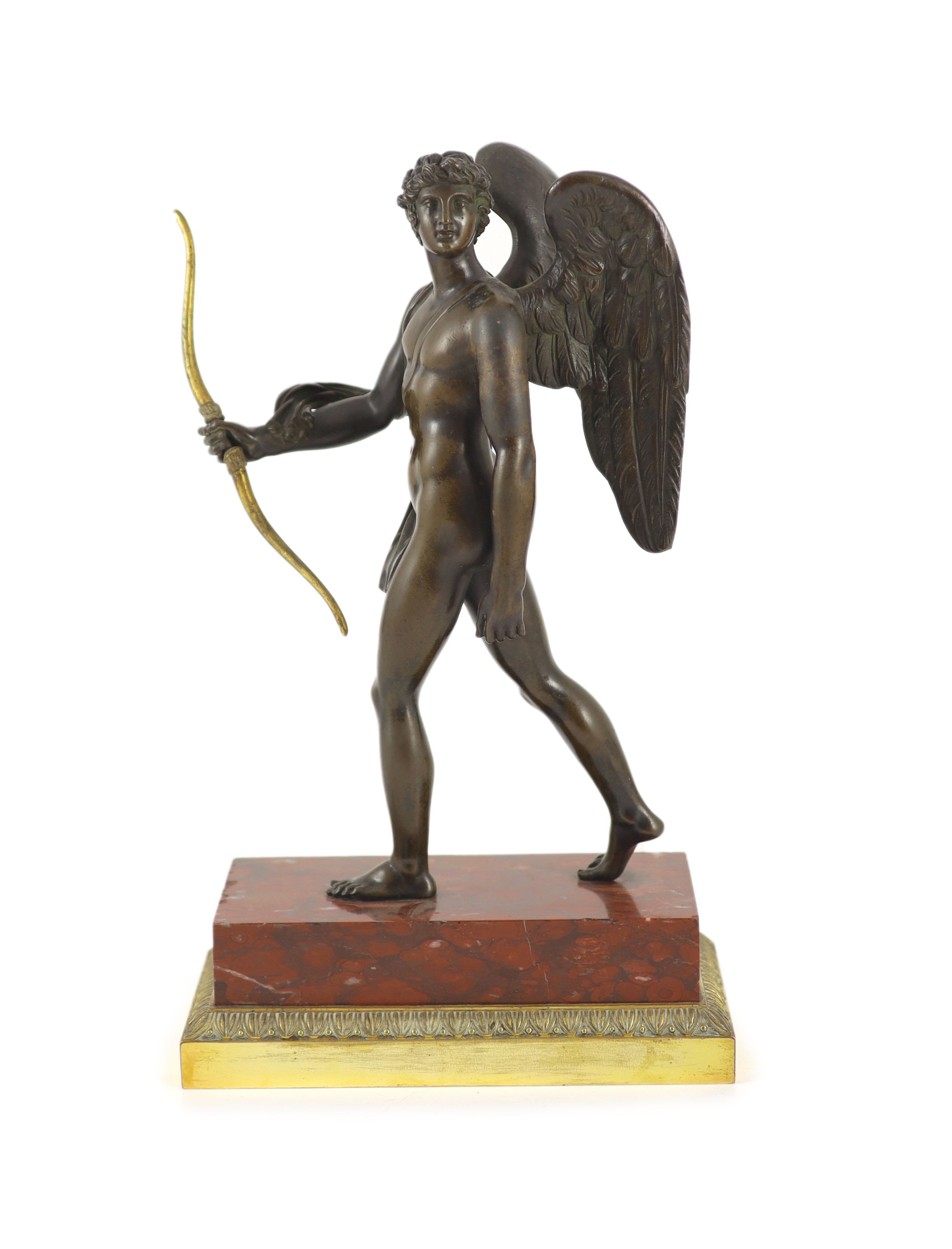 A 19th century bronze figure of Eros, H 37cm. W 22cm. D 12cm.